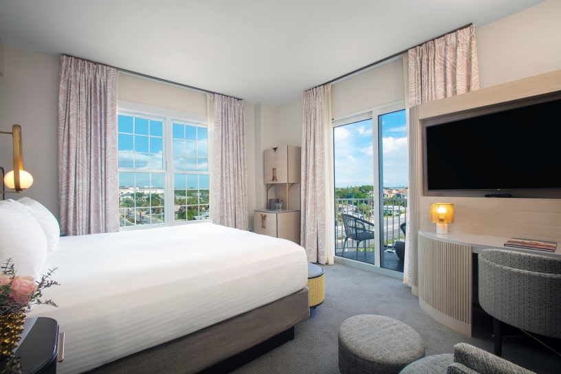 bedroom with bed and views of the city