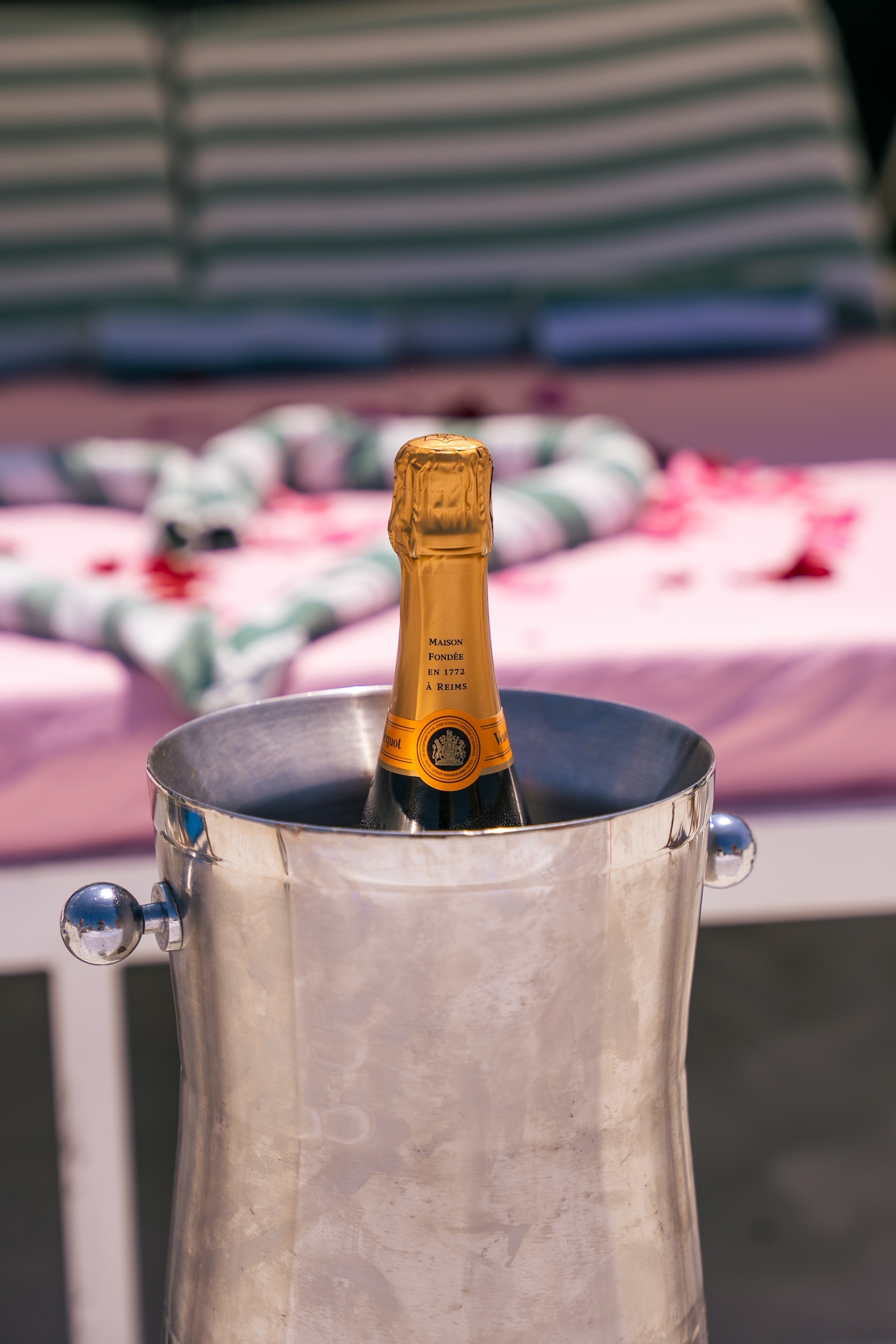 a bottle of champagne in a ice bucket